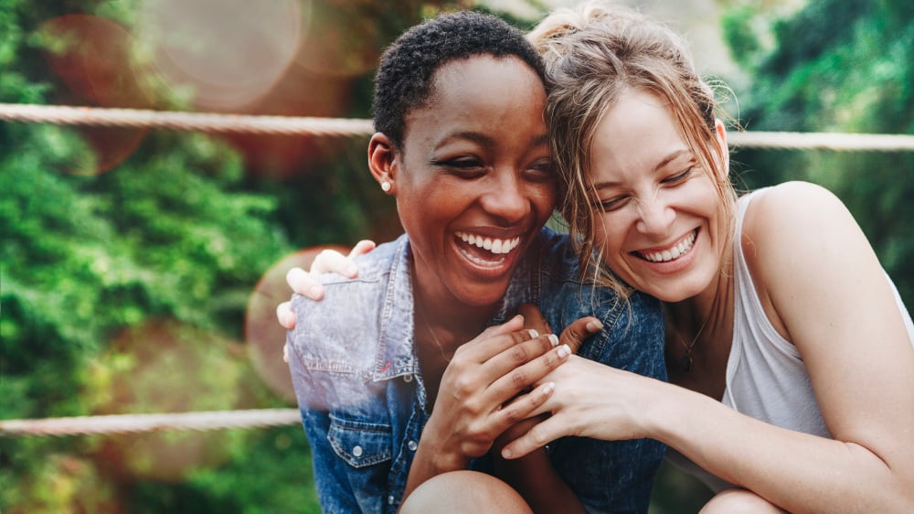 Laughing is good for us: two women laughing