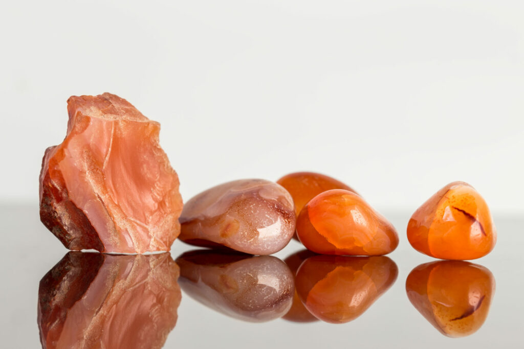 red Carnelian stones laying next to one another