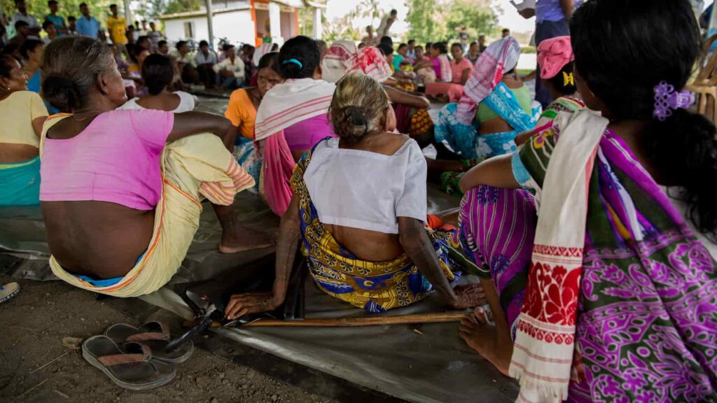 Tea pickers at a meeting with an NGO to learn about educating their children and their rights