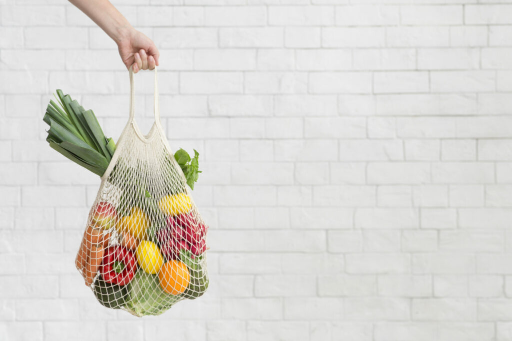 woman holding reusable bag 