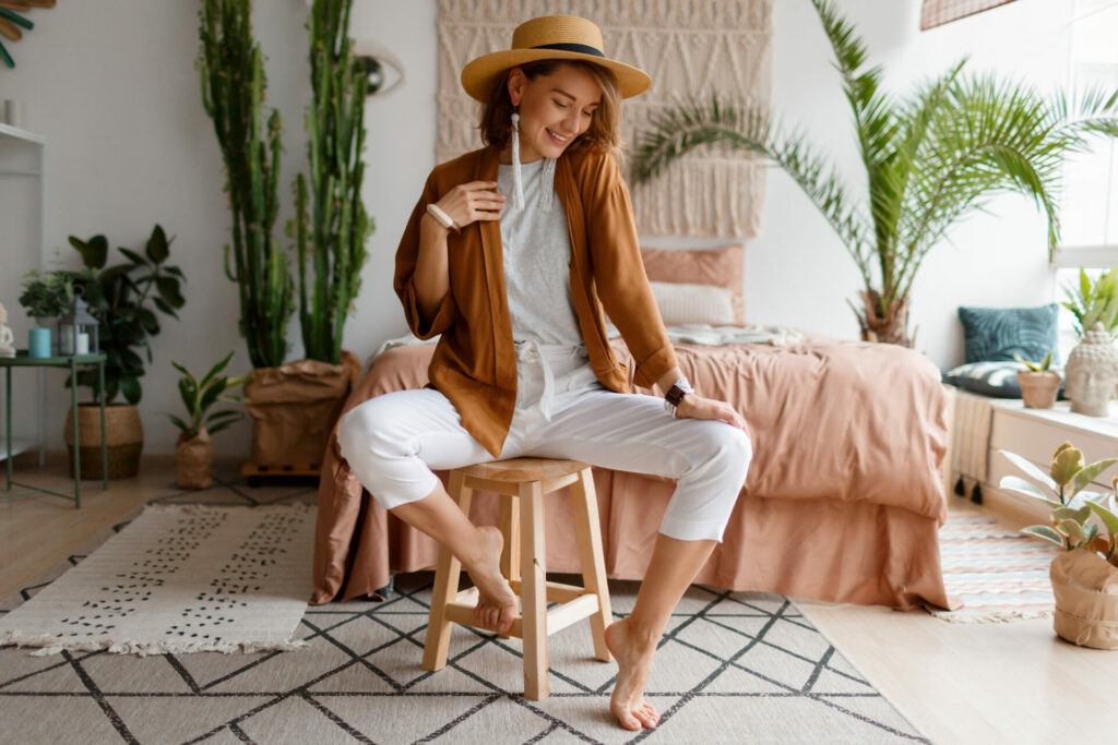 lady sit on bed in sustainable clothes