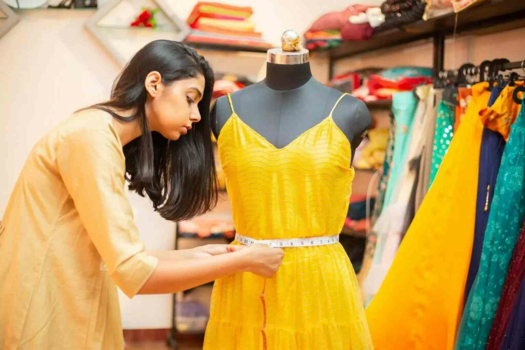 woman making yellow dress