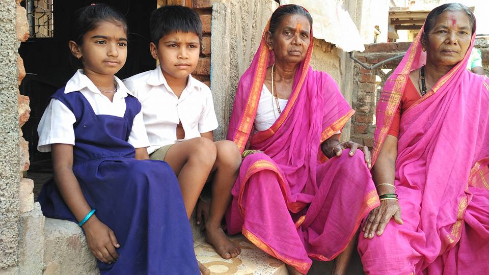 grannies going to school are being helped with their homework by their grandchildren 