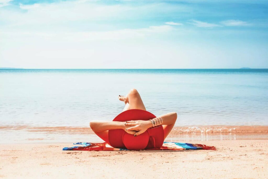 a woman sun bathing with sunscreen