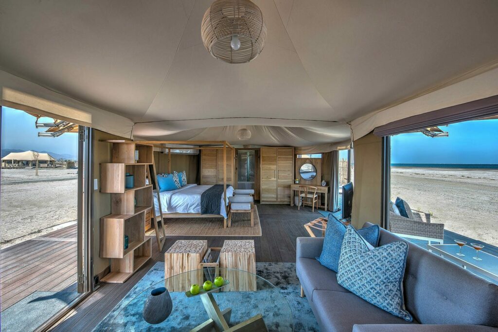 inside the tented villa looking out to sea with muted interior