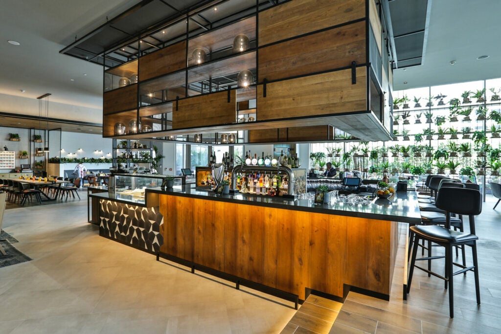 view of bar with lots of modern wood decor