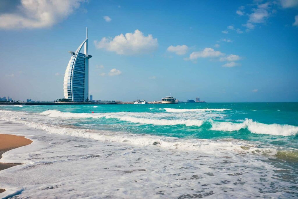 frothy waves and burj al arab as one of the best free UAE beaches