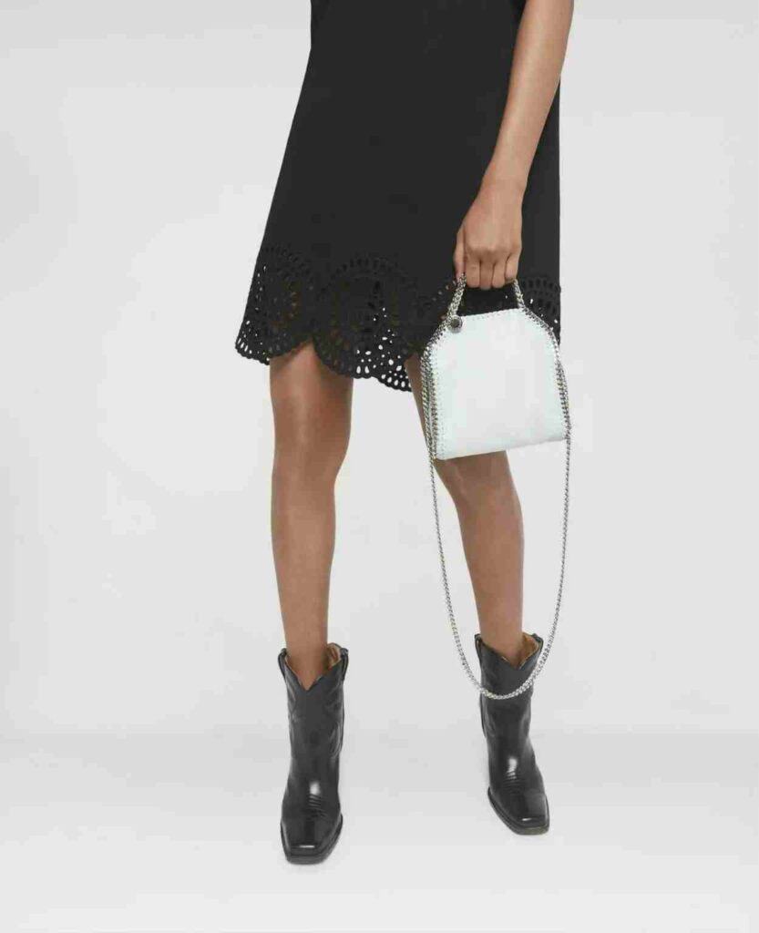 Model holding Stella McCartney's Falabella bag
