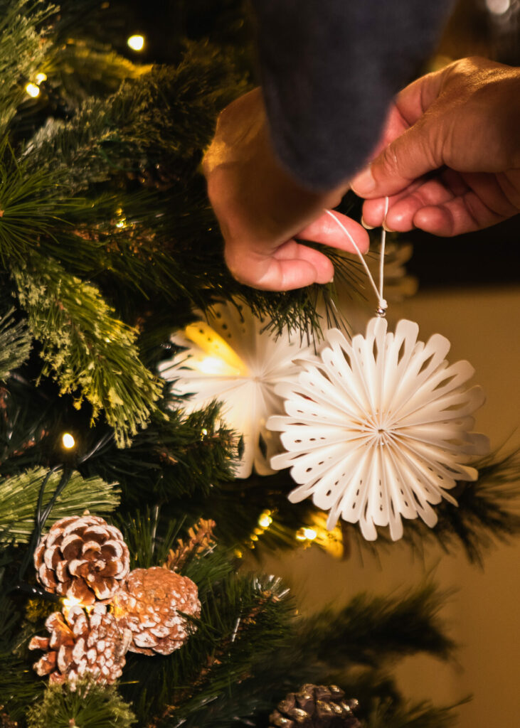 a paper snowflake makes the perfect eco decoration on a christmas tree