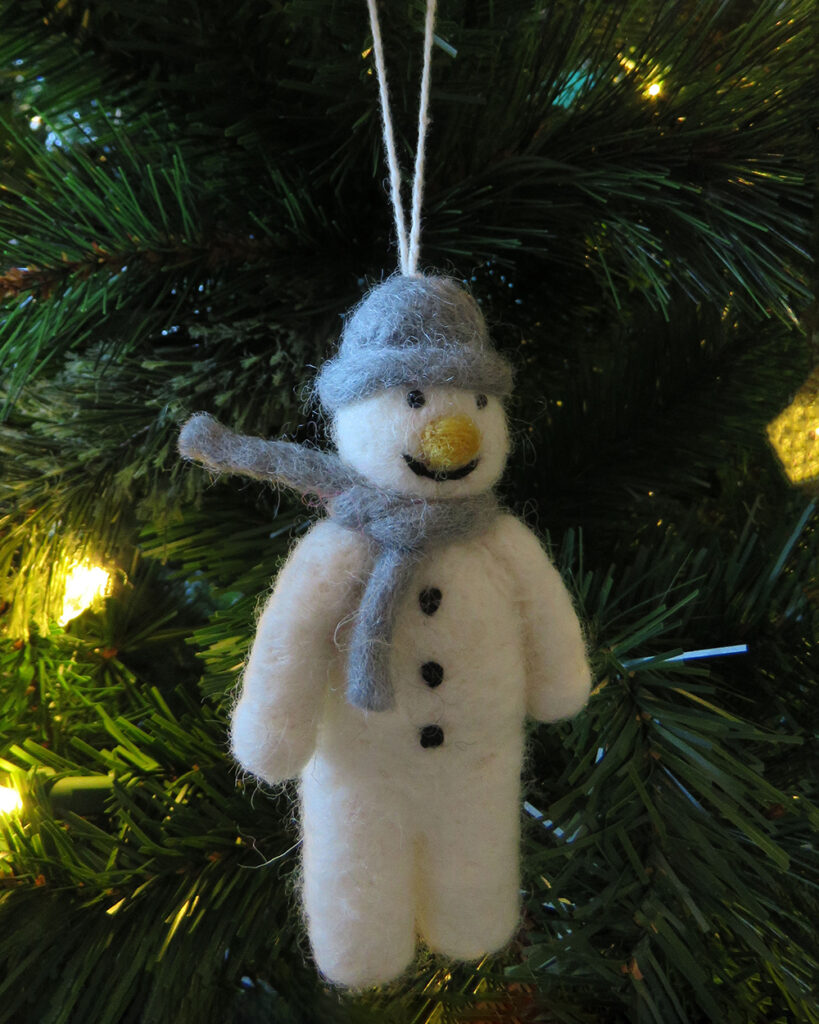 Sustainable snowman Christmas tree eco decoration hanging on tree