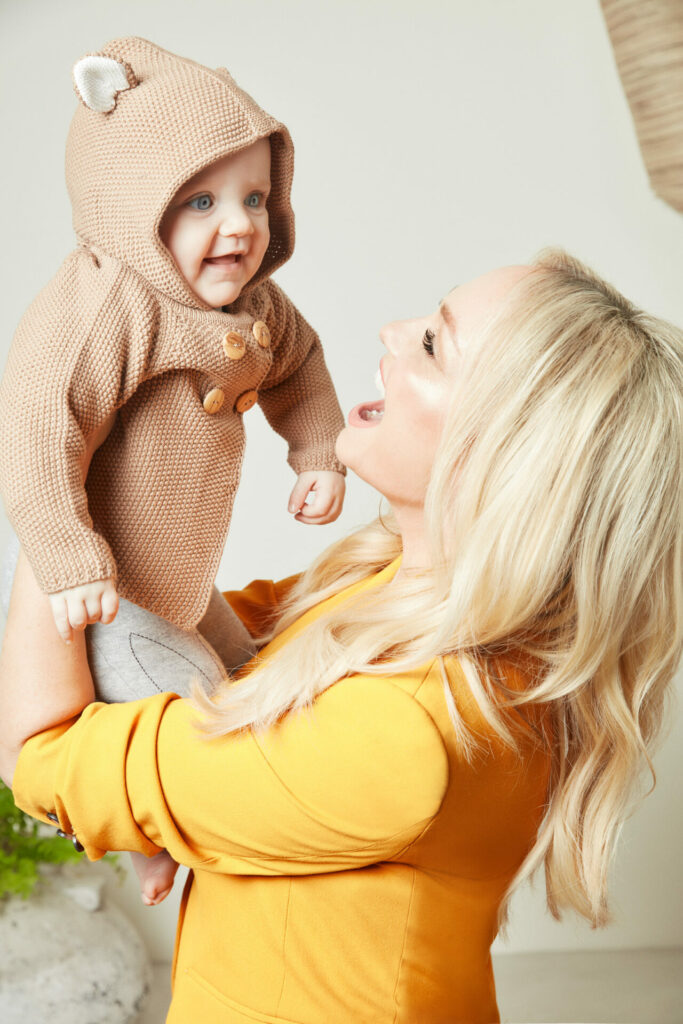 Emma Bunton smiling at baby 