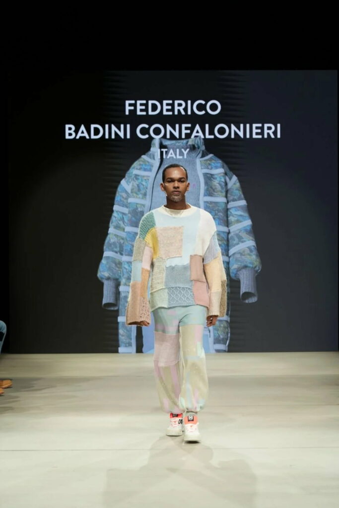 man on catwalk at Redress fashion show