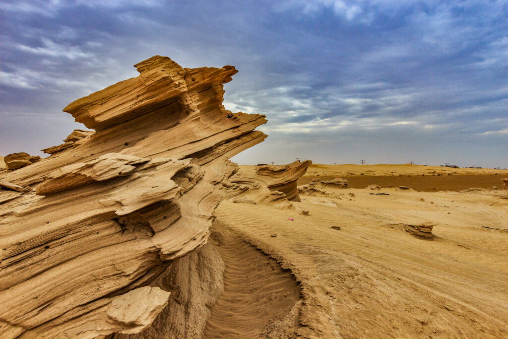 fossil dunes in the desert with cloudy sky