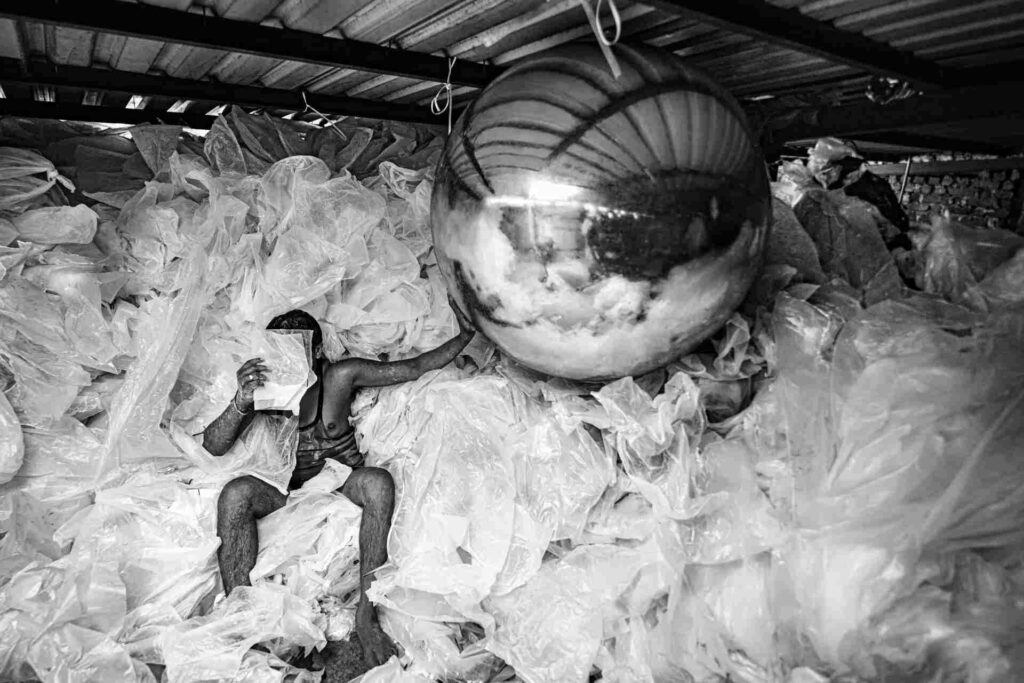 Worker at recycling unit in Mumbai, India, one of the most polluted cities in world