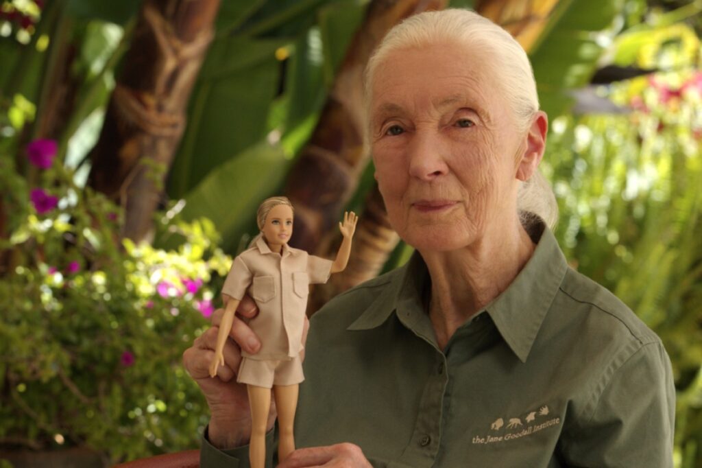 Jane Goodall holding the Dr Jane Goodall barbie doll 