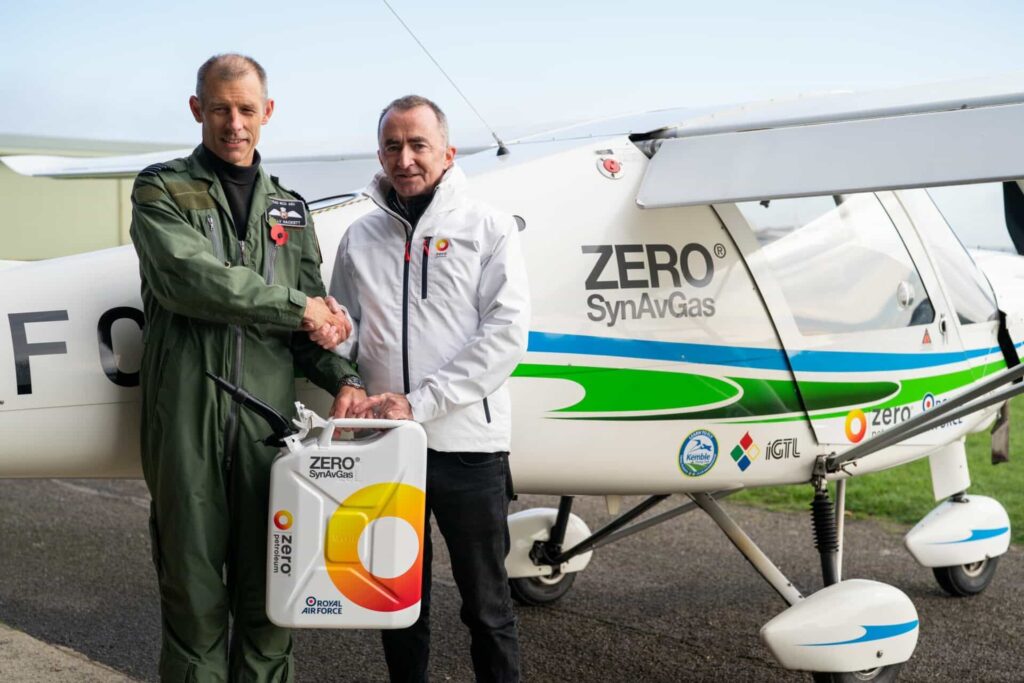 Paddy Lowe shaking hands with pilot holding a zero petrol canister