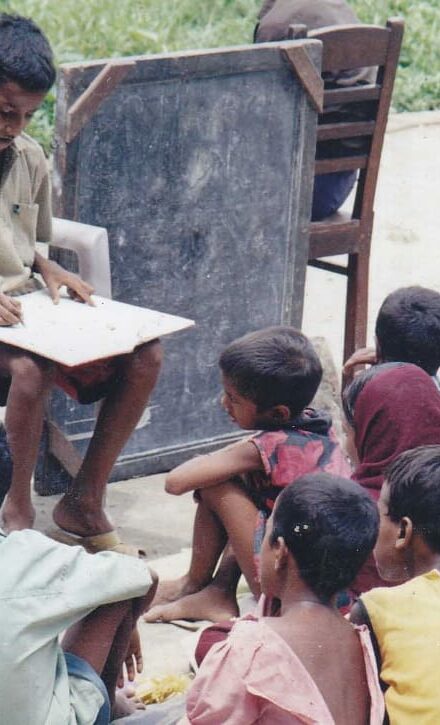 Barbar Ali teaching in his backyard school at age of nine
