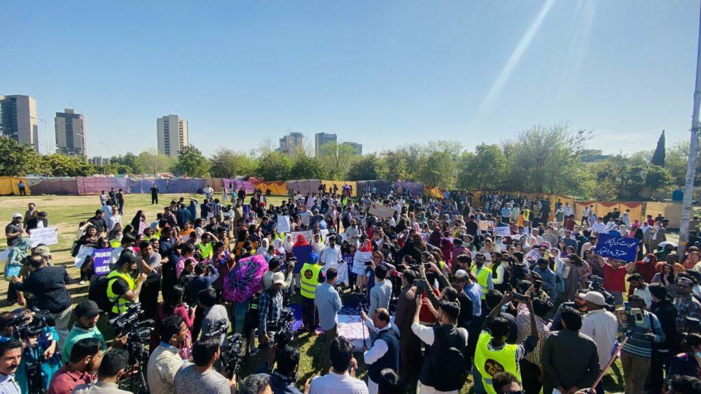 women rallying for climate justice