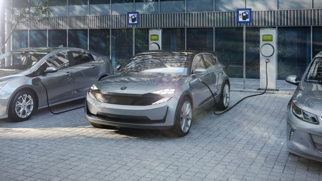 electric cars charging at a public charger