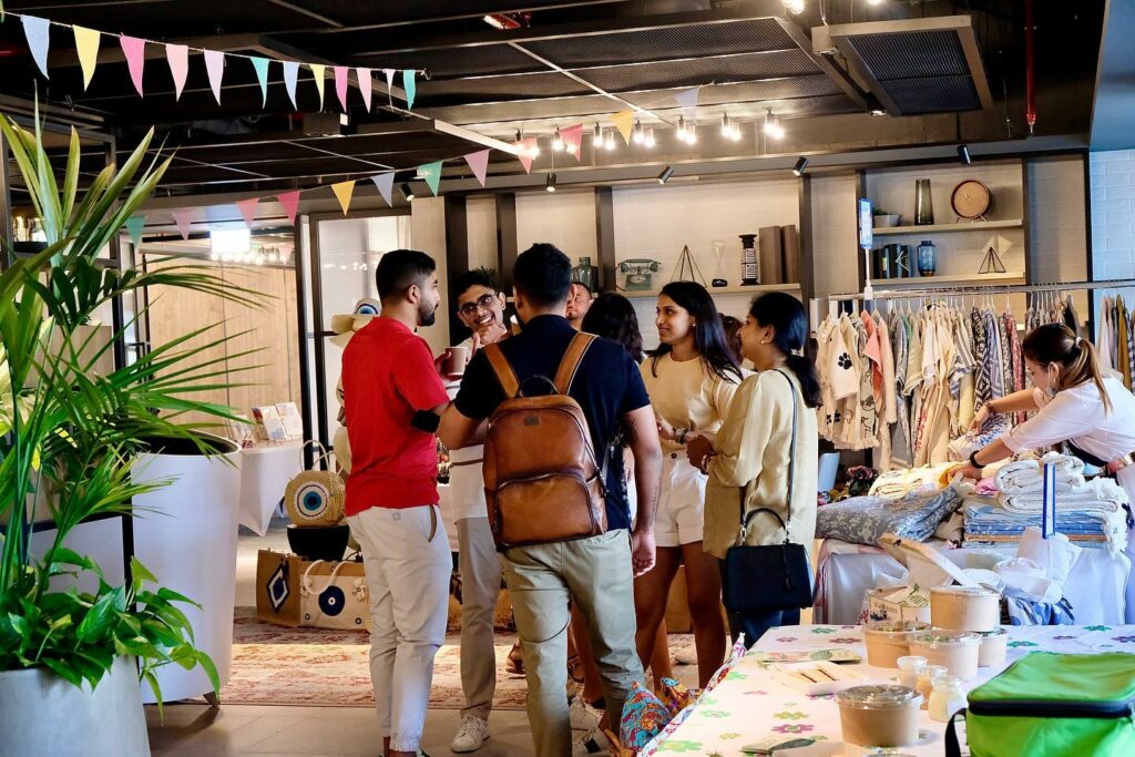 group of friends chat at one of the country's outdoor markets