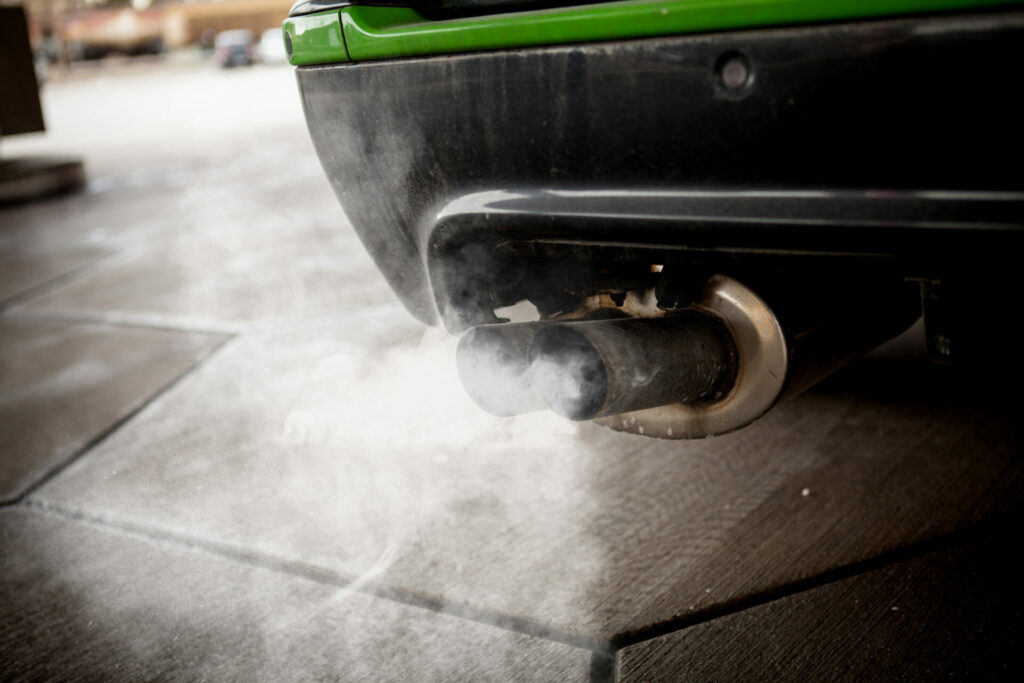 Fossil fuel cars exhaust pumping out smoke 