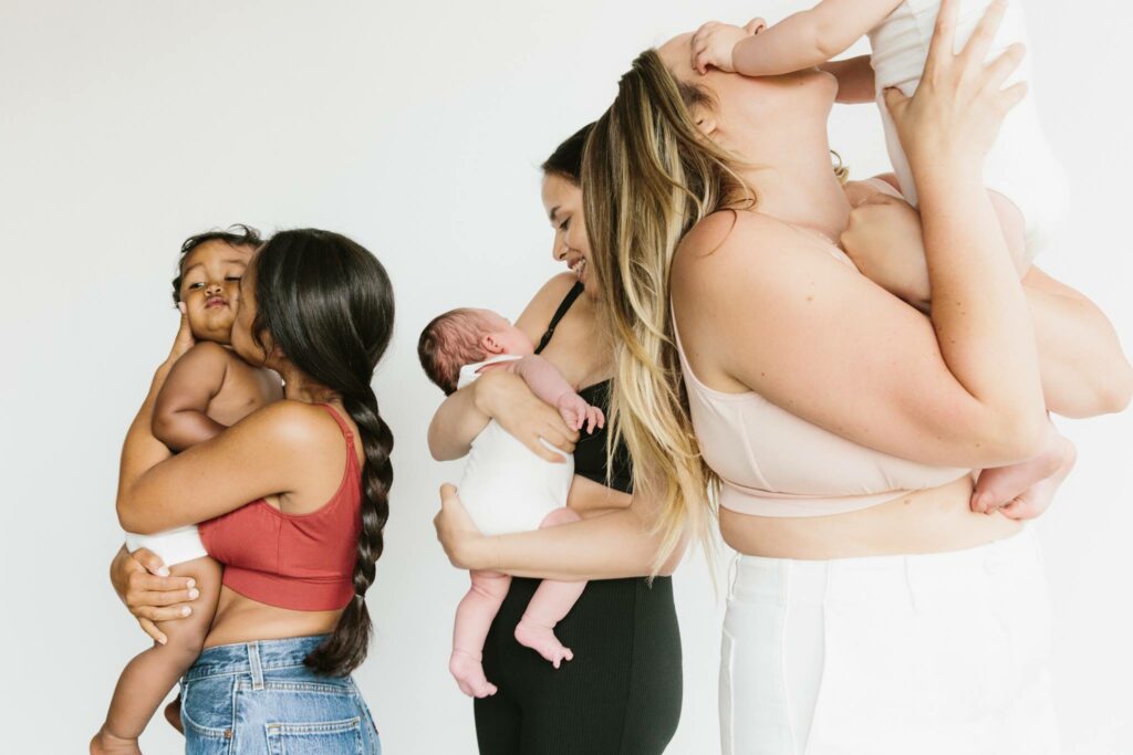 mothers kissing their babies in comfy bras 