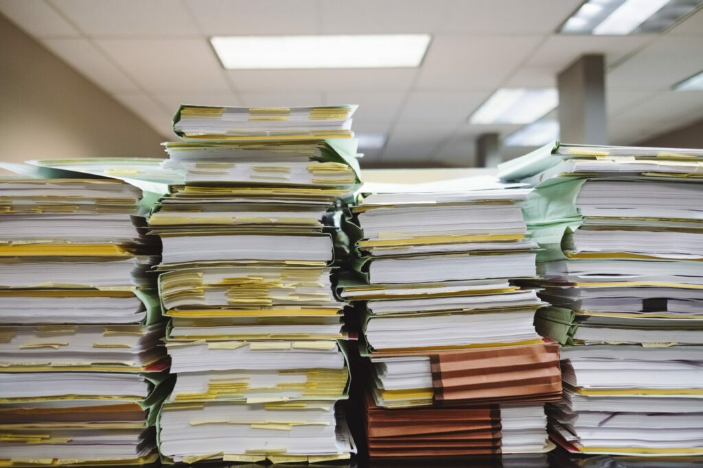 stacks of paper illustrating our throwaway culture 