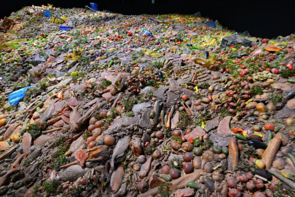 GIANT FOOD WASTE mountain showing that food production is one of the most polluting industries in the world 