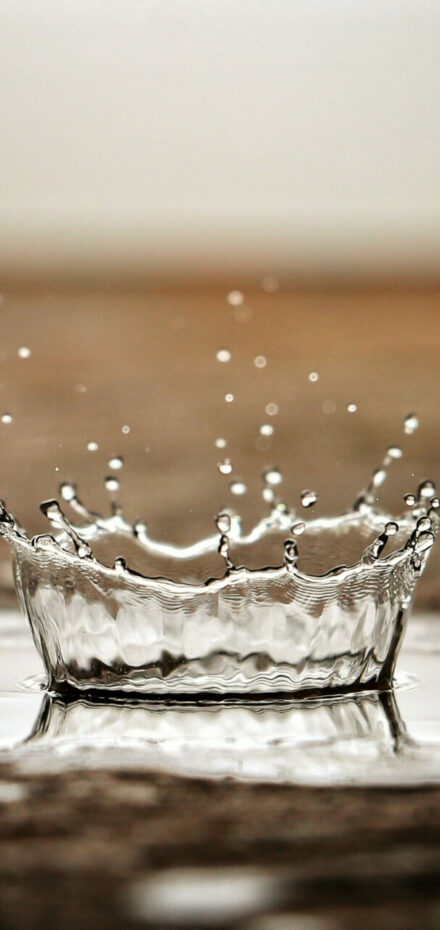 rain drop hitting arid ground after cloud seeding