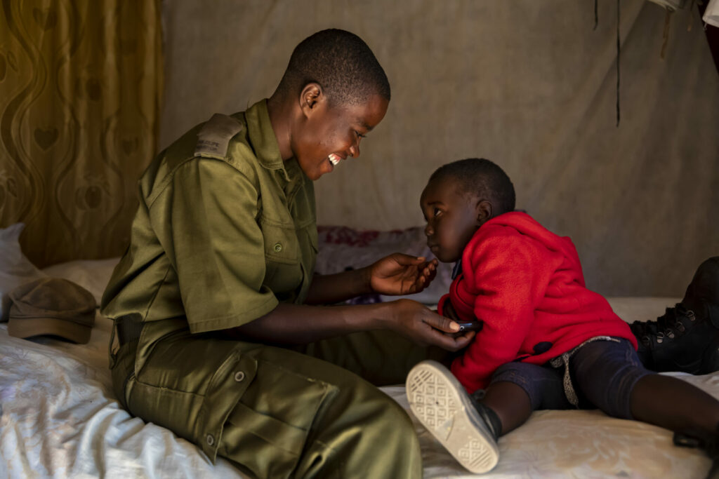 Primrose is a female ranger in zimbabwe and is playing with her young daughter. The picture is to highlight World Female Ranger Week 