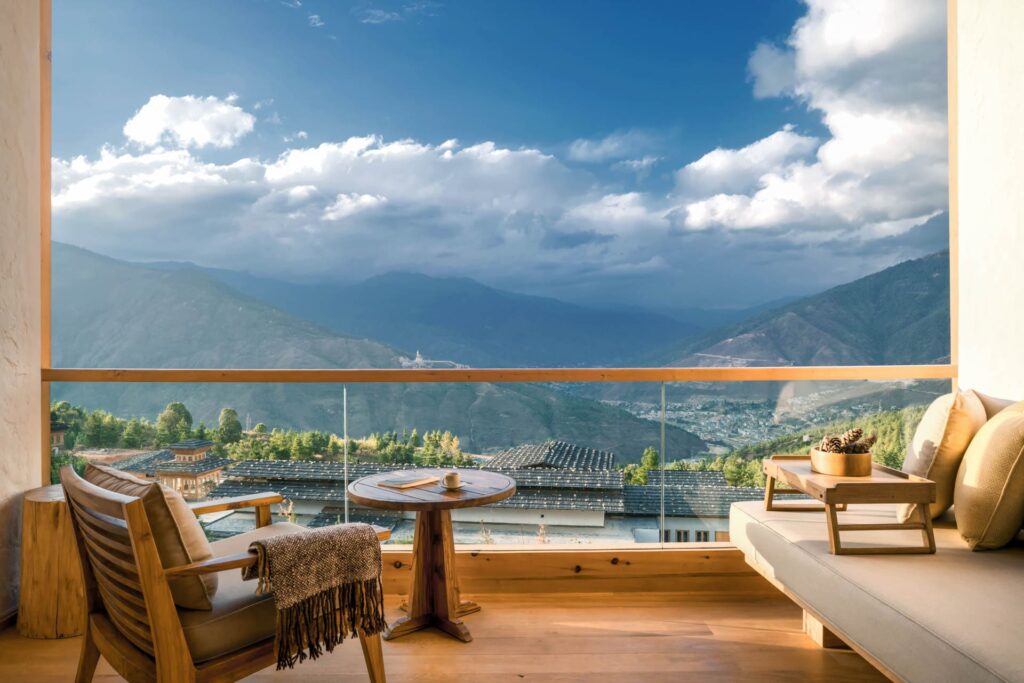 bedroom balcony of six senses thimphu overlooking a valley in Bhutan 