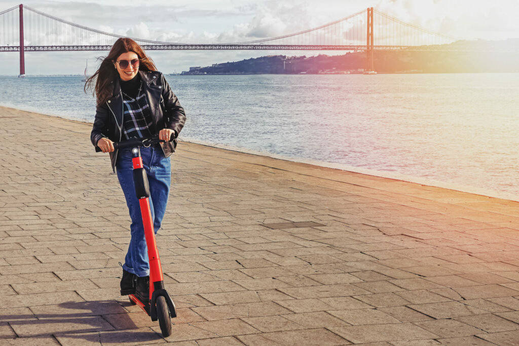 woman on scooter in city