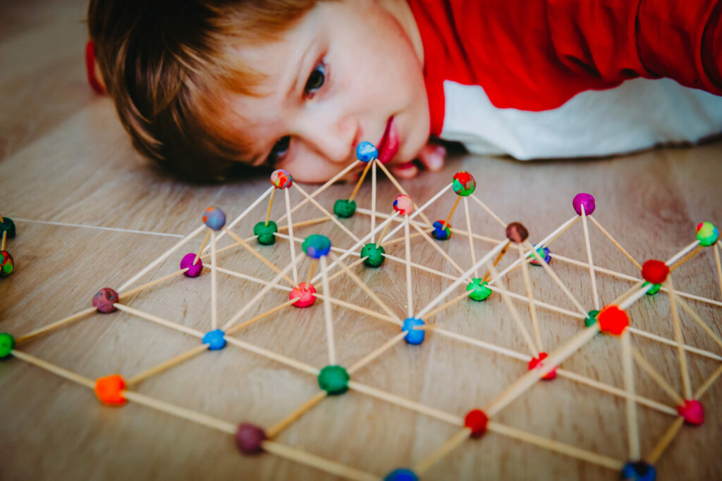 boy looking at stem activity