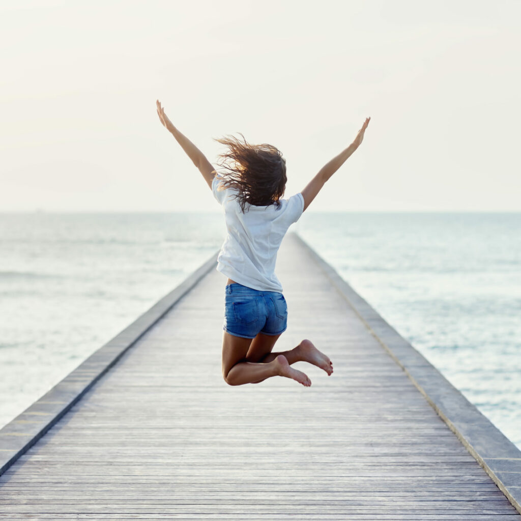 woman jumping with joy