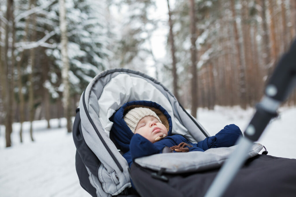 baby asleep outside in buggy in Finland