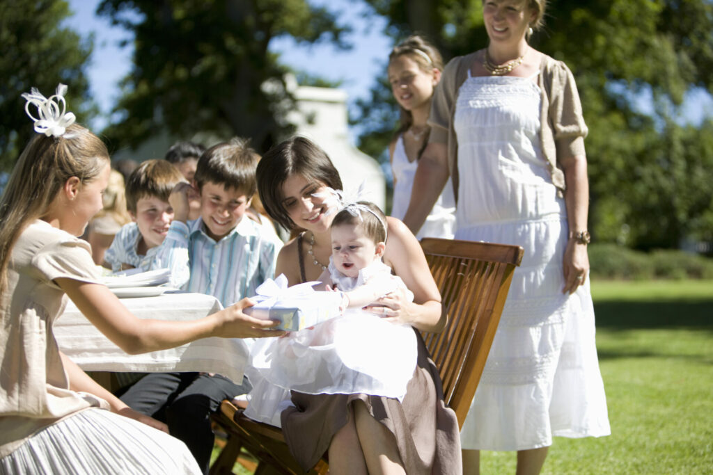 girl giving eco gifts at a christening 