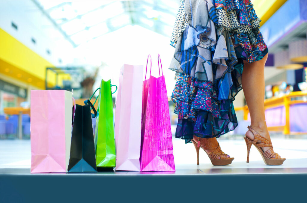 woman with lots of shopping bags is part of hype culture 