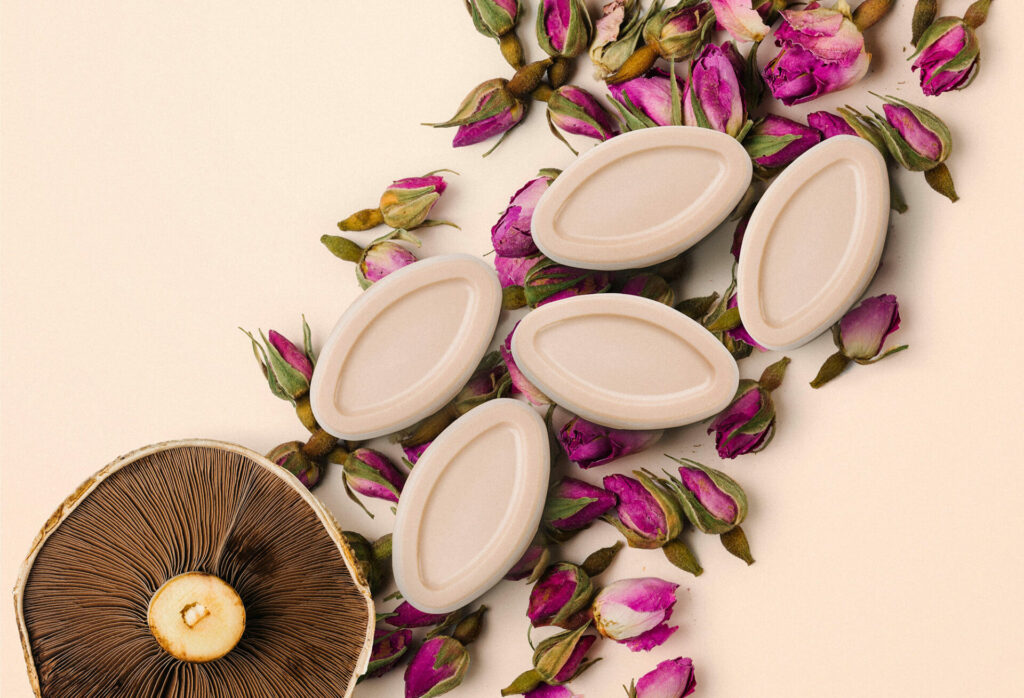 essential oil soaps with rose buds and a mushroom 