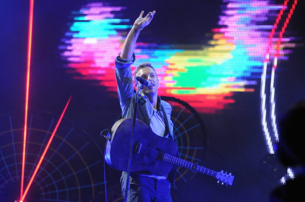 Chris Martin waving on stage