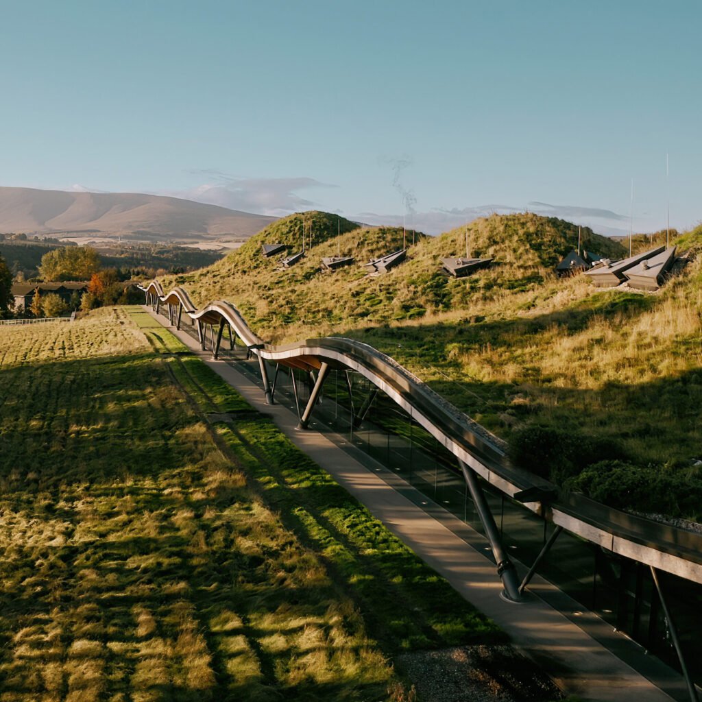 The Macallan distillery with the roof covered in grass and wildflowers