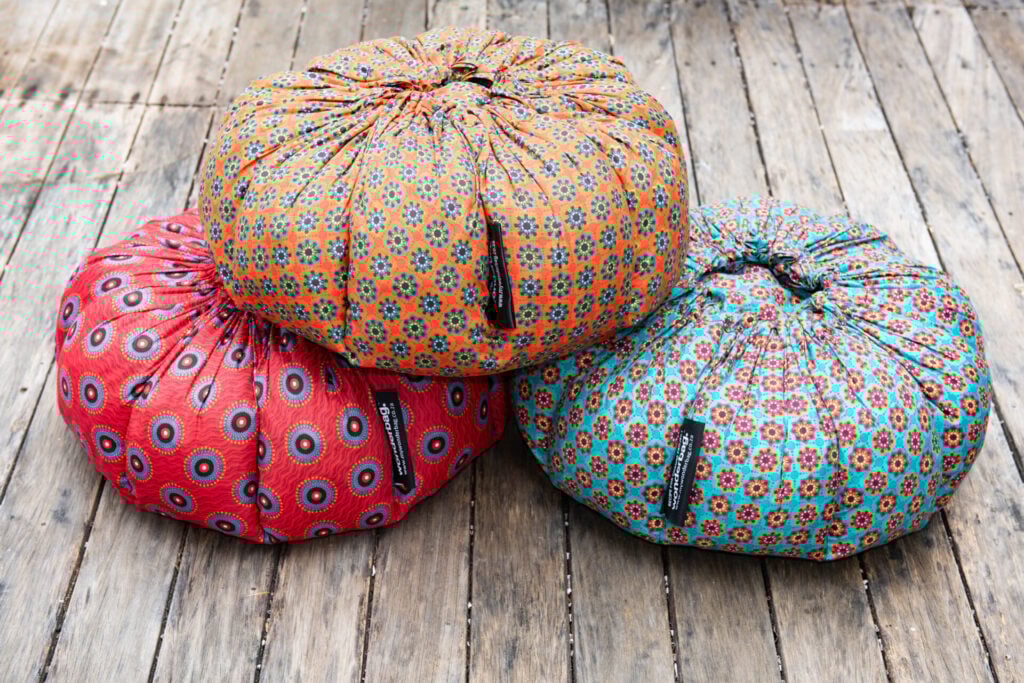 Three wonderbags placed on a wooden floor