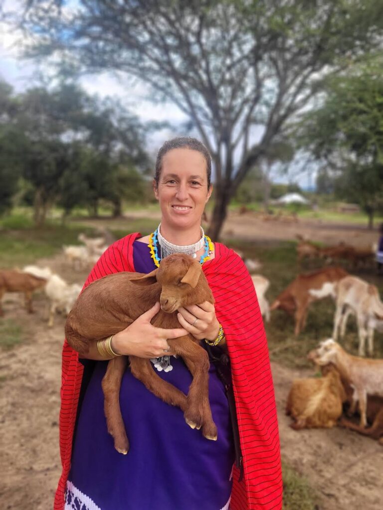 Stephanie Fuchs holding a baby goat