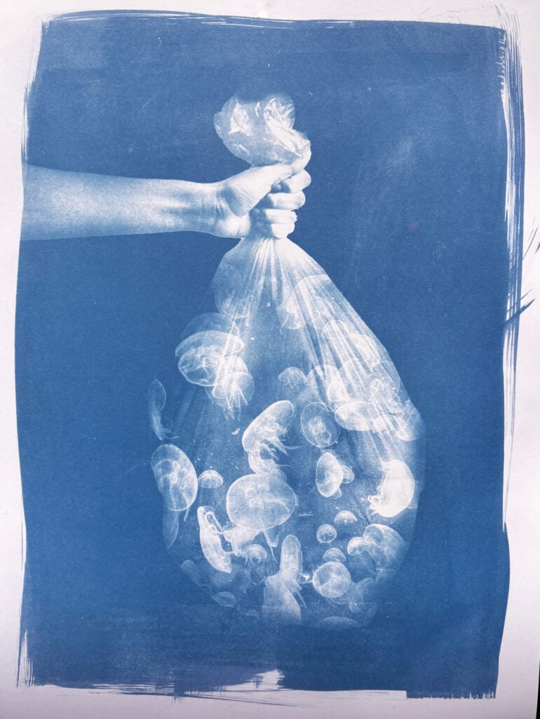hand holding garbage which features in the art exhibition