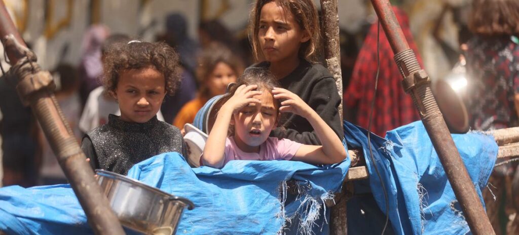 child in Gaza at aid point