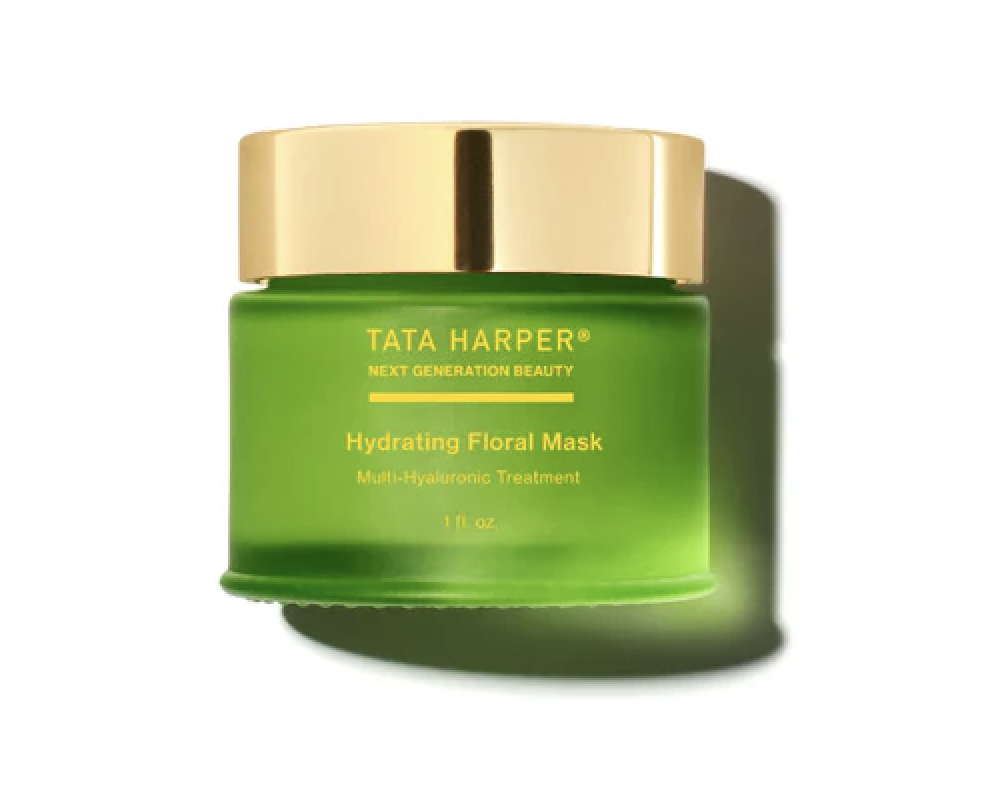 a green container with gold lid