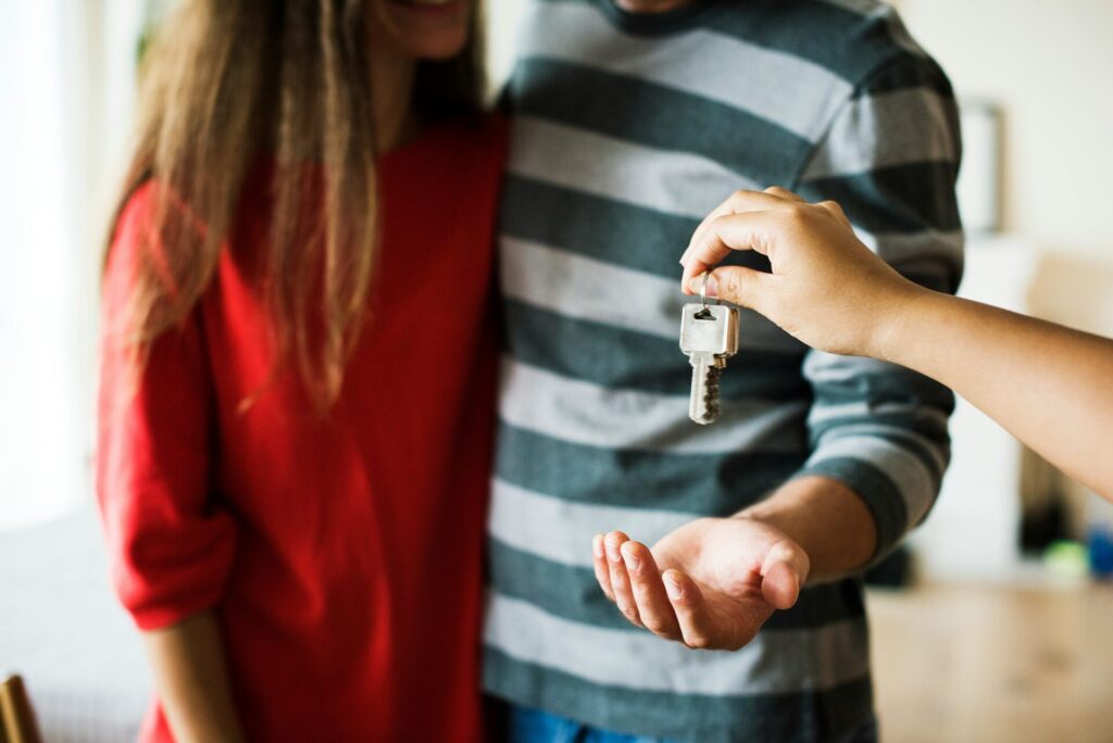 couple getting key to their first home