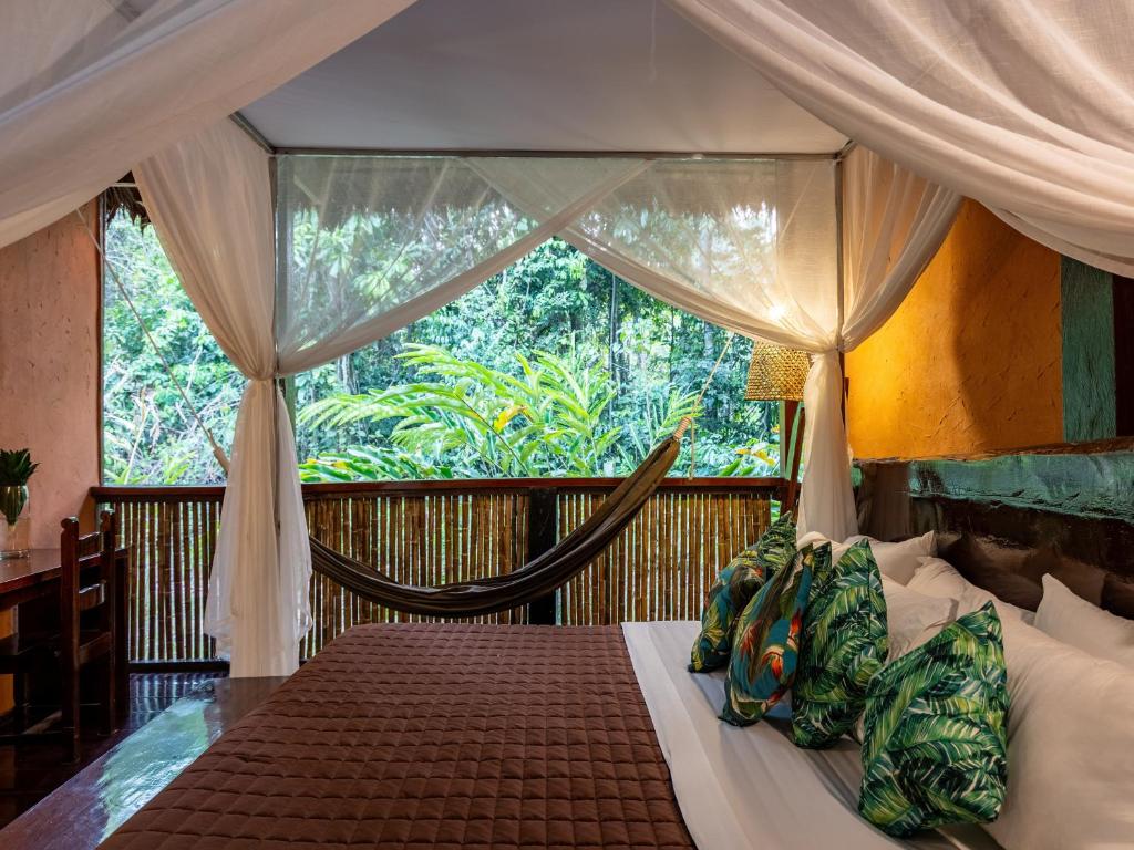Bedroom looking out to jungle at Posada Amazonas