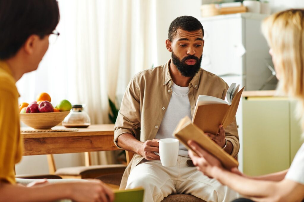 man reading in book club