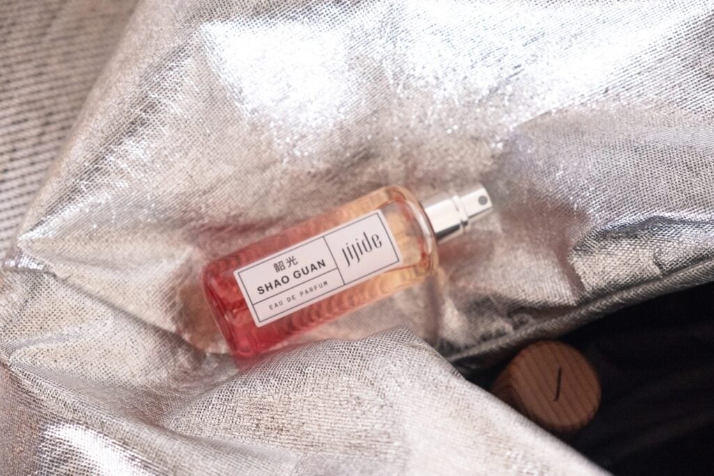 Perfume bottle in shiny bag