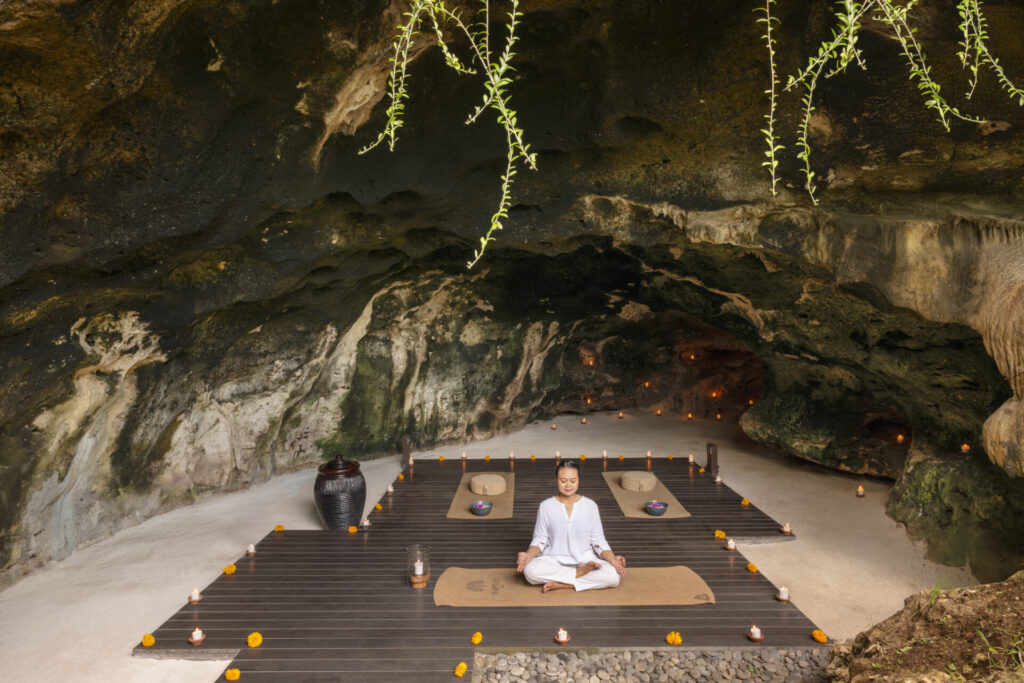a woman sitting in a yoga pose